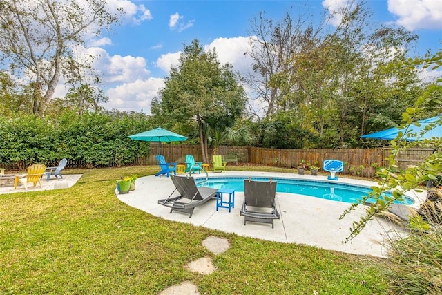 view of swimming pool with a lawn, a patio area, a fenced backyard, and a fenced in pool