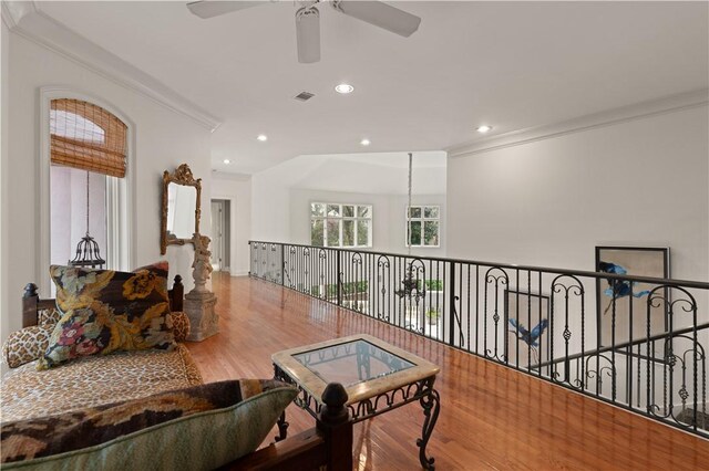 316 Forest Oaks, Saint Simons Island, GA 31522 - living area with crown molding, recessed lighting, visible vents, ceiling fan, and wood finished floors