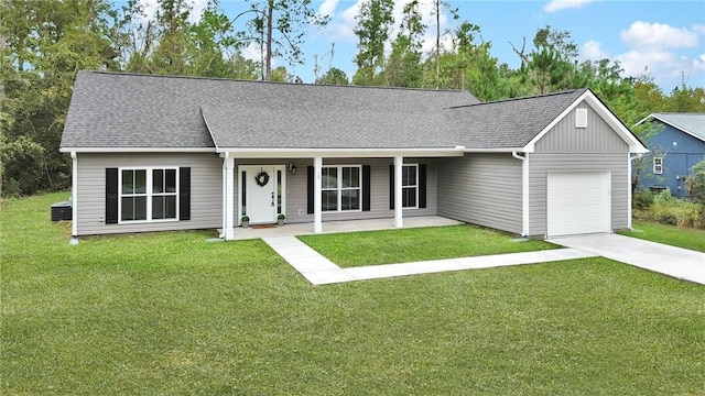 ranch-style home featuring a porch, a garage, and a front lawn