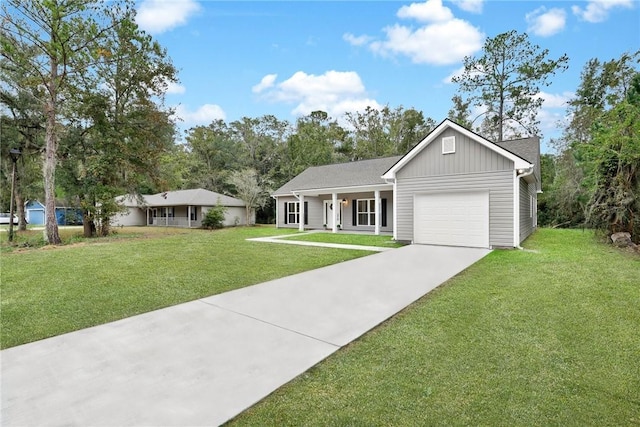 view of front of home with a porch, a garage, and a front yard