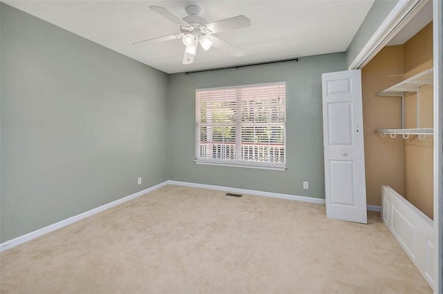 212 Stillwater Dr, Brunswick, GA 31525 - unfurnished bedroom with light colored carpet, ceiling fan, baseboards, and a closet