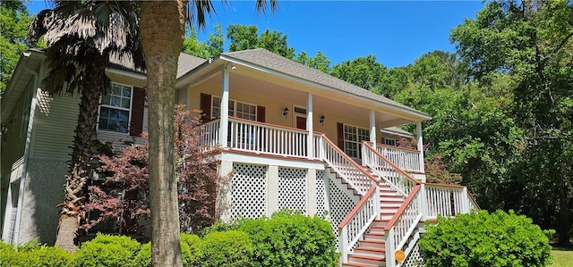 212 Stillwater Dr, Brunswick, GA 31525 - view of front of property with roof with shingles, covered porch, and stairs