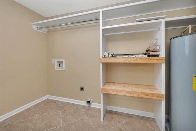 212 Stillwater Dr, Brunswick, GA 31525 - laundry area featuring tile patterned floors, gas water heater, hookup for a washing machine, baseboards, and electric dryer hookup