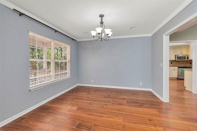 212 Stillwater Dr, Brunswick, GA 31525 - empty room with light wood-type flooring, baseboards, a notable chandelier, and crown molding