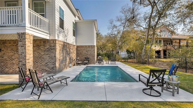 view of swimming pool with a patio