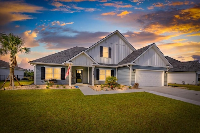 69 Allie Loop, Brunswick, GA 31525 - view of front of property featuring board and batten siding, driveway, a garage, and a shingled roof