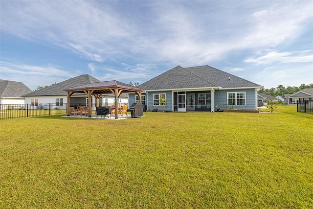 69 Allie Loop, Brunswick, GA 31525 - rear view of property featuring a gazebo, a sunroom, a patio, and a shingled roof