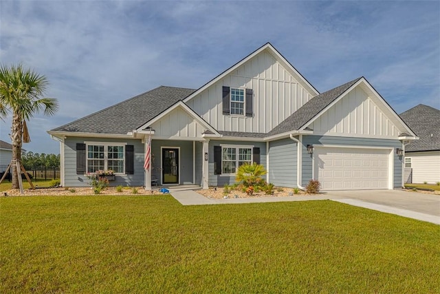 69 Allie Loop, Brunswick, GA 31525 - view of front facade featuring board and batten siding, concrete driveway, a garage, a front yard, and a shingled roof