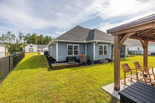 69 Allie Loop, Brunswick, GA 31525 - rear view of house featuring a fenced backyard and a shingled roof