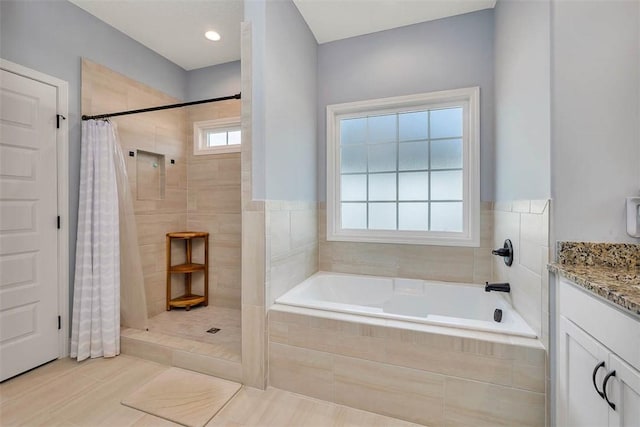 69 Allie Loop, Brunswick, GA 31525 - full bath with a garden tub, vanity, a tile shower, and tile patterned flooring