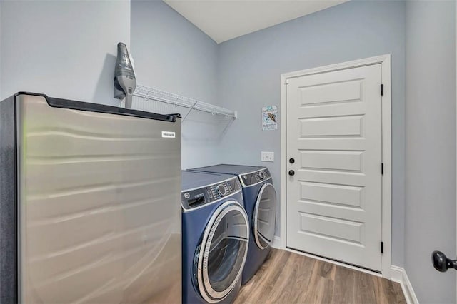 69 Allie Loop, Brunswick, GA 31525 - laundry room with washing machine and clothes dryer and wood finished floors