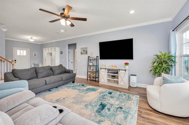 69 Allie Loop, Brunswick, GA 31525 - living room featuring wood finished floors, ceiling fan, ornamental molding, recessed lighting, and stairs