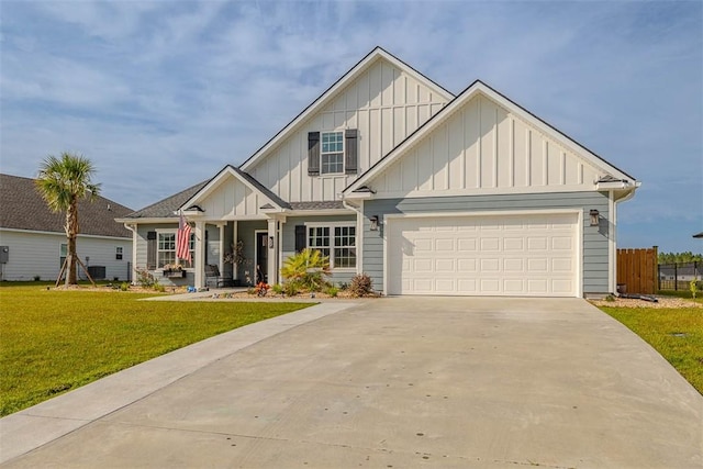 69 Allie Loop, Brunswick, GA 31525 - view of front of property with board and batten siding, concrete driveway, a garage, and a porch