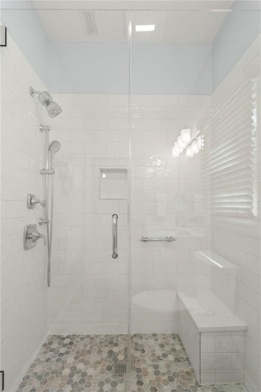 full bath with tile patterned floors and a stall shower
