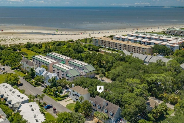 bird's eye view with a water view and a beach view