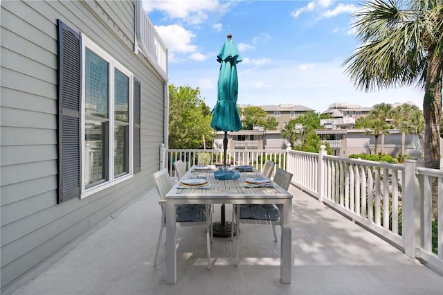 view of patio / terrace with a residential view and outdoor dining space