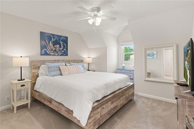 bedroom featuring baseboards, ceiling fan, carpet, and a textured ceiling