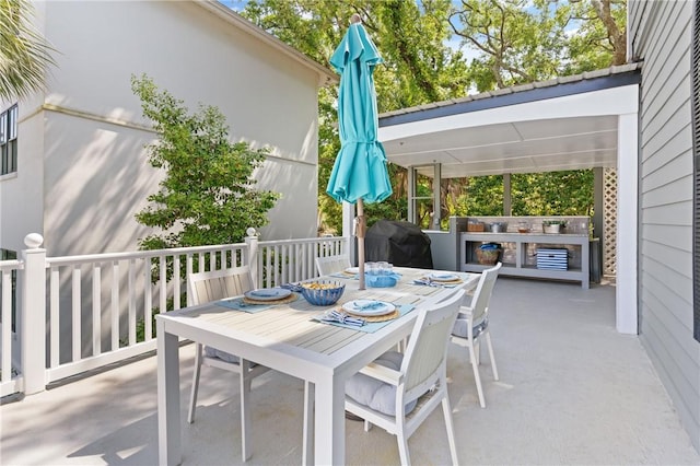 view of patio / terrace featuring outdoor dining space and grilling area