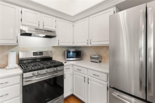 kitchen featuring light countertops, white cabinetry, appliances with stainless steel finishes, and under cabinet range hood