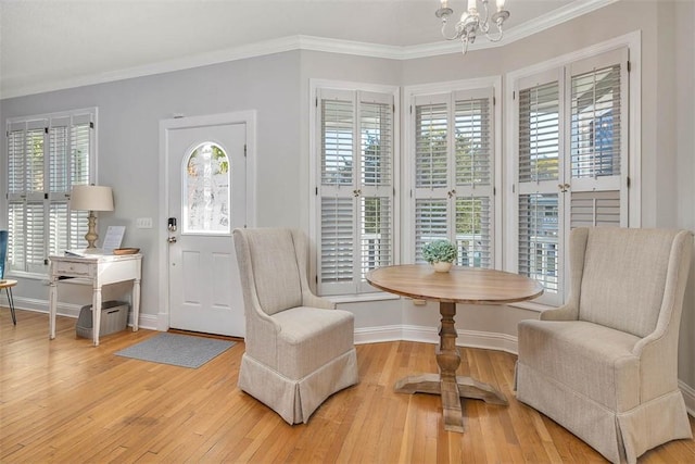 interior space with plenty of natural light, light wood-style flooring, and a chandelier
