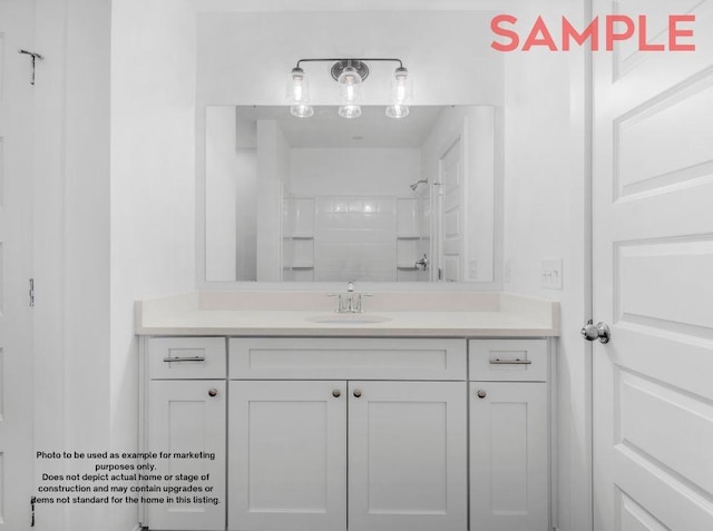 bathroom with vanity and a shower