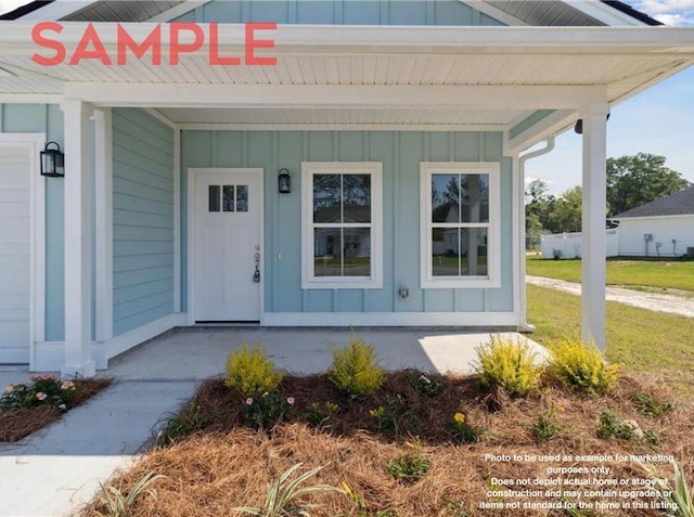 property entrance featuring a yard and a porch