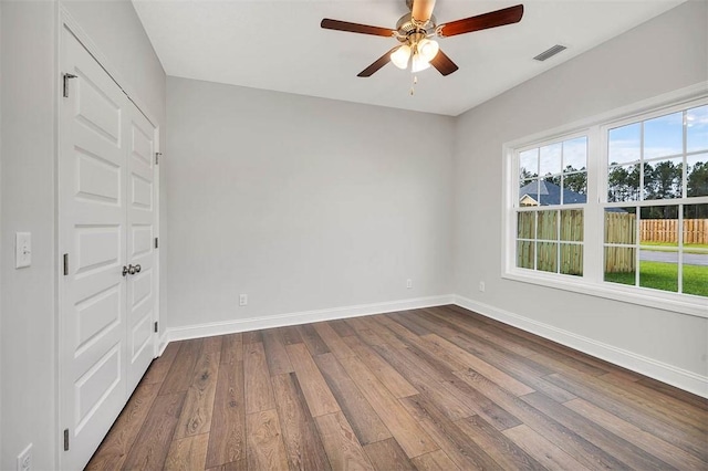 spare room featuring ceiling fan and wood-type flooring