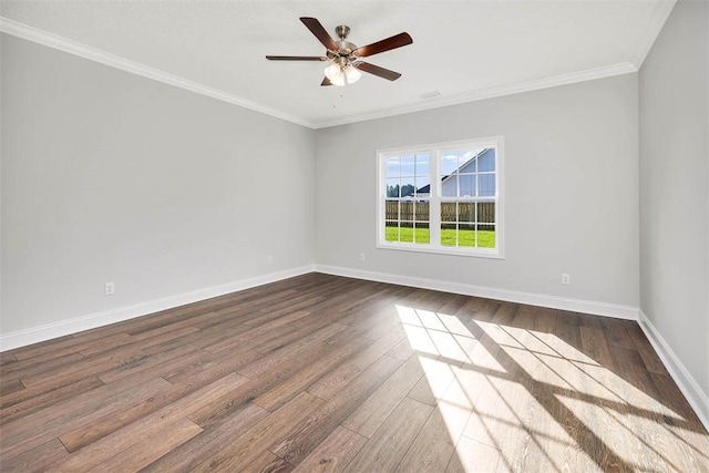 spare room with ceiling fan, wood-type flooring, and ornamental molding