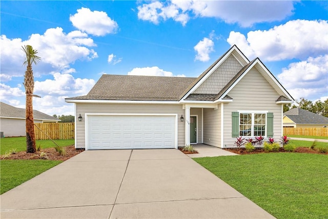 view of front of house with a front yard and a garage