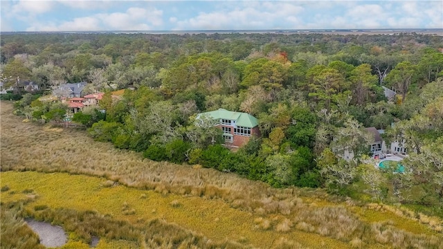 birds eye view of property featuring a wooded view