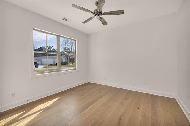 unfurnished room with ceiling fan and light hardwood / wood-style flooring