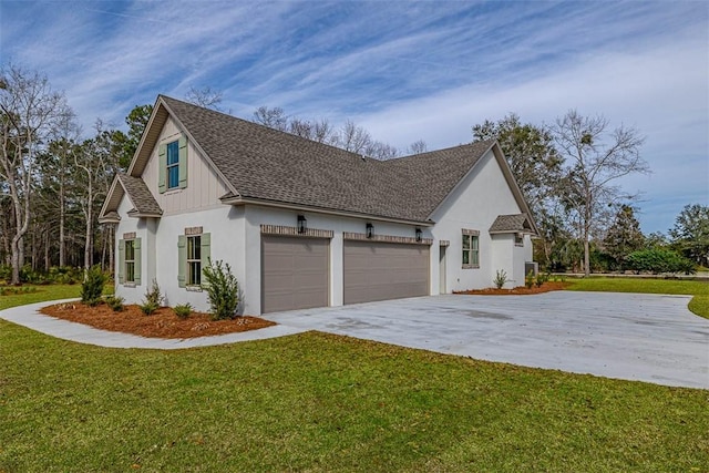 view of side of property featuring a yard and a garage