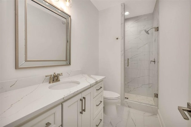 bathroom featuring vanity, toilet, and walk in shower