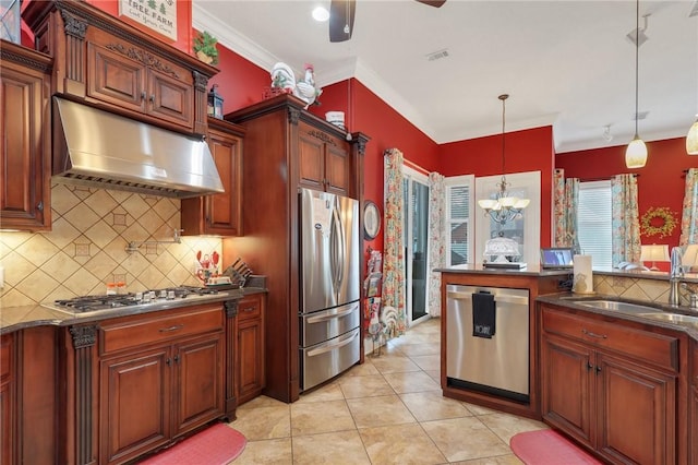 kitchen featuring a sink, dark countertops, under cabinet range hood, and stainless steel appliances