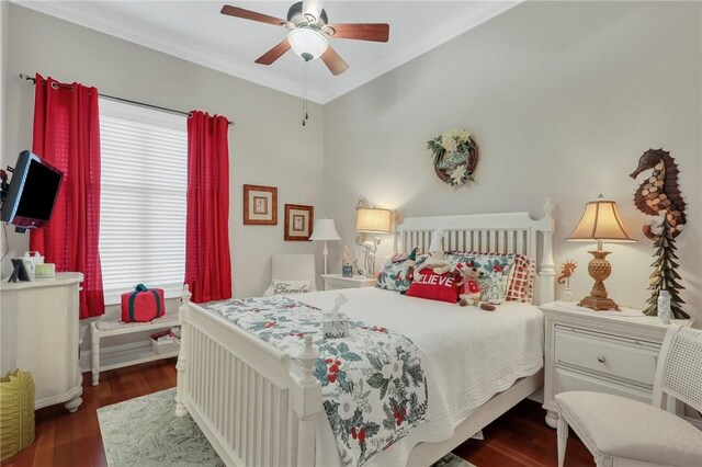 bedroom with ceiling fan, wood finished floors, and crown molding