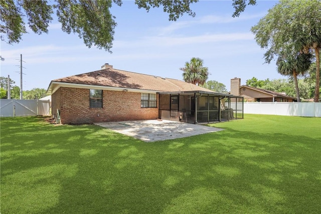 300 Bushoan Rd, Brunswick, GA 31525 - rear view of property with a sunroom, a patio area, brick siding, a gate, and a chimney