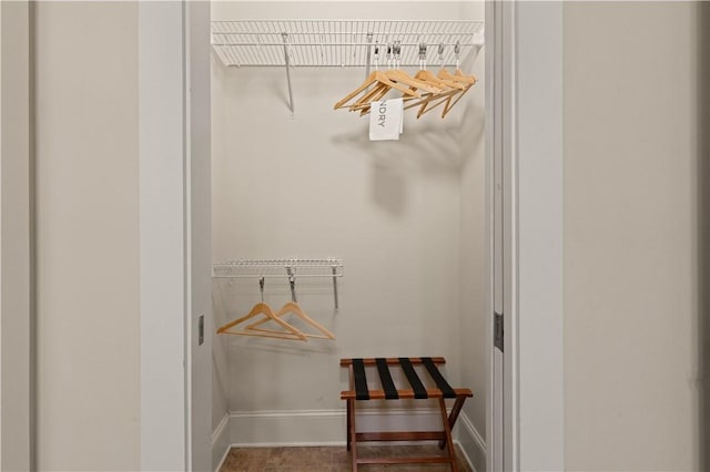 spacious closet with tile patterned floors