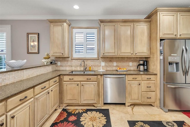 122 Country Club Dr, Saint Simons Island, GA 31522 - kitchen with light brown cabinetry, appliances with stainless steel finishes, ornamental molding, sink, and dark stone countertops