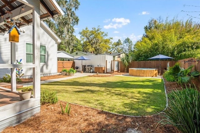 view of yard with a patio, a fenced backyard, a shed, an outdoor structure, and a hot tub