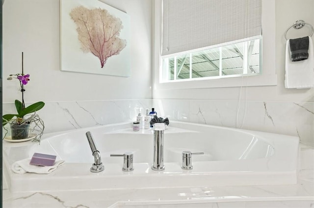 bathroom featuring a garden tub