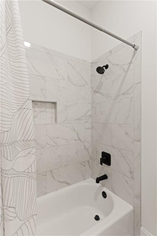 bathroom featuring shower / bath combination with curtain