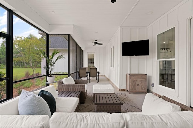 sunroom / solarium with an outdoor hangout area, ceiling fan, and outdoor dining area