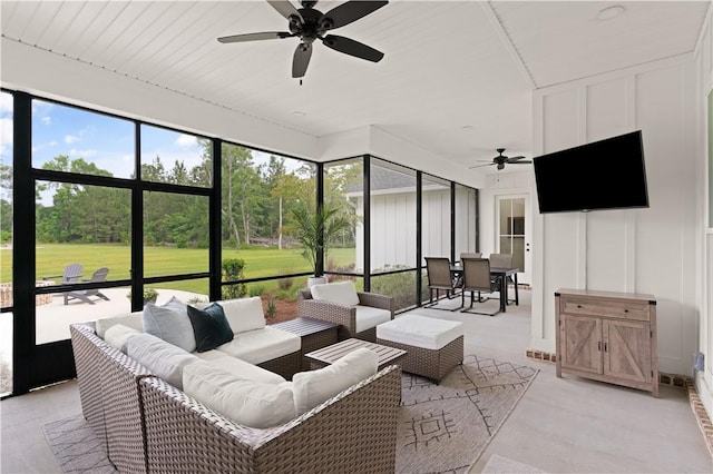 sunroom / solarium with ceiling fan, an outdoor hangout area, and outdoor dining space