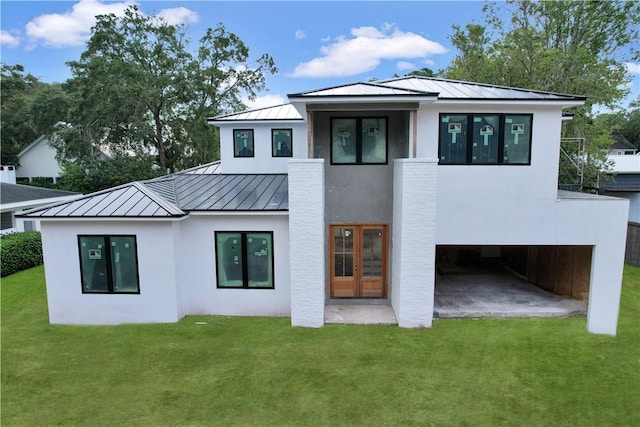 back of property featuring a patio area and a yard