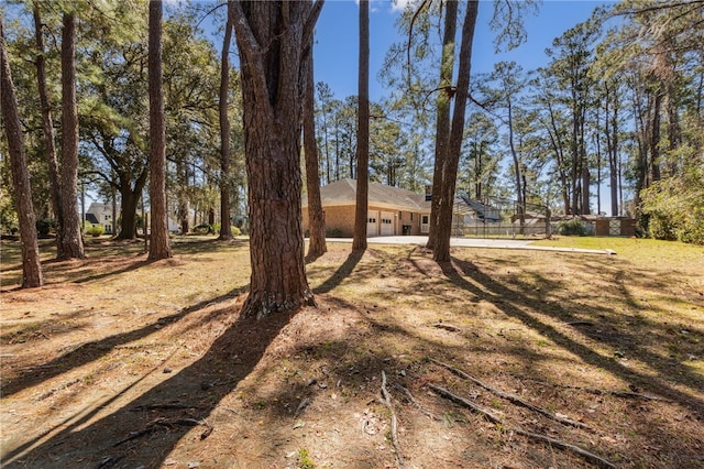 view of yard featuring a garage