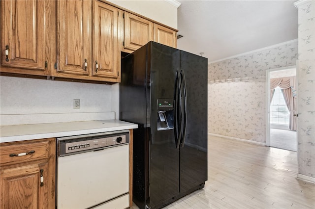 kitchen with ornamental molding, white dishwasher, black fridge with ice dispenser, and wallpapered walls