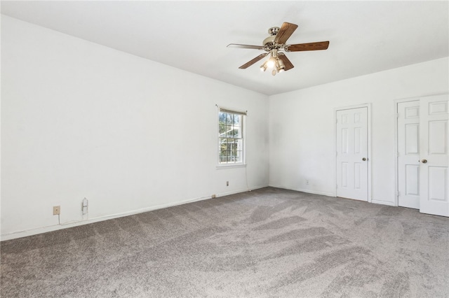 unfurnished bedroom featuring carpet and ceiling fan