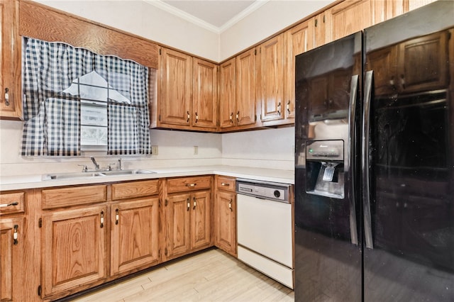 kitchen featuring dishwasher, black refrigerator with ice dispenser, crown molding, light countertops, and a sink