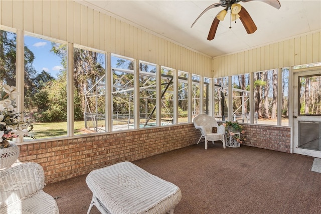 sunroom with a ceiling fan