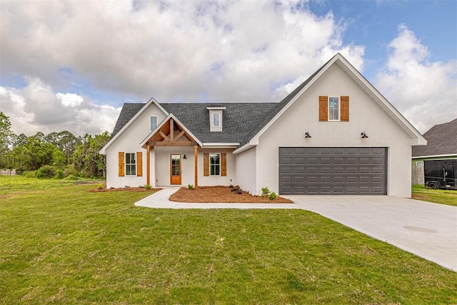 225 Water Crest Dr, Brunswick, GA 31523 - modern farmhouse style home featuring a front yard, driveway, a garage, stucco siding, and a shingled roof